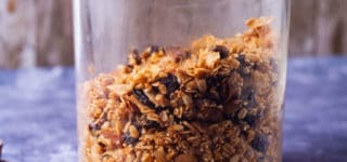 Healthy crunchy homemade granola stored in a glass jar.