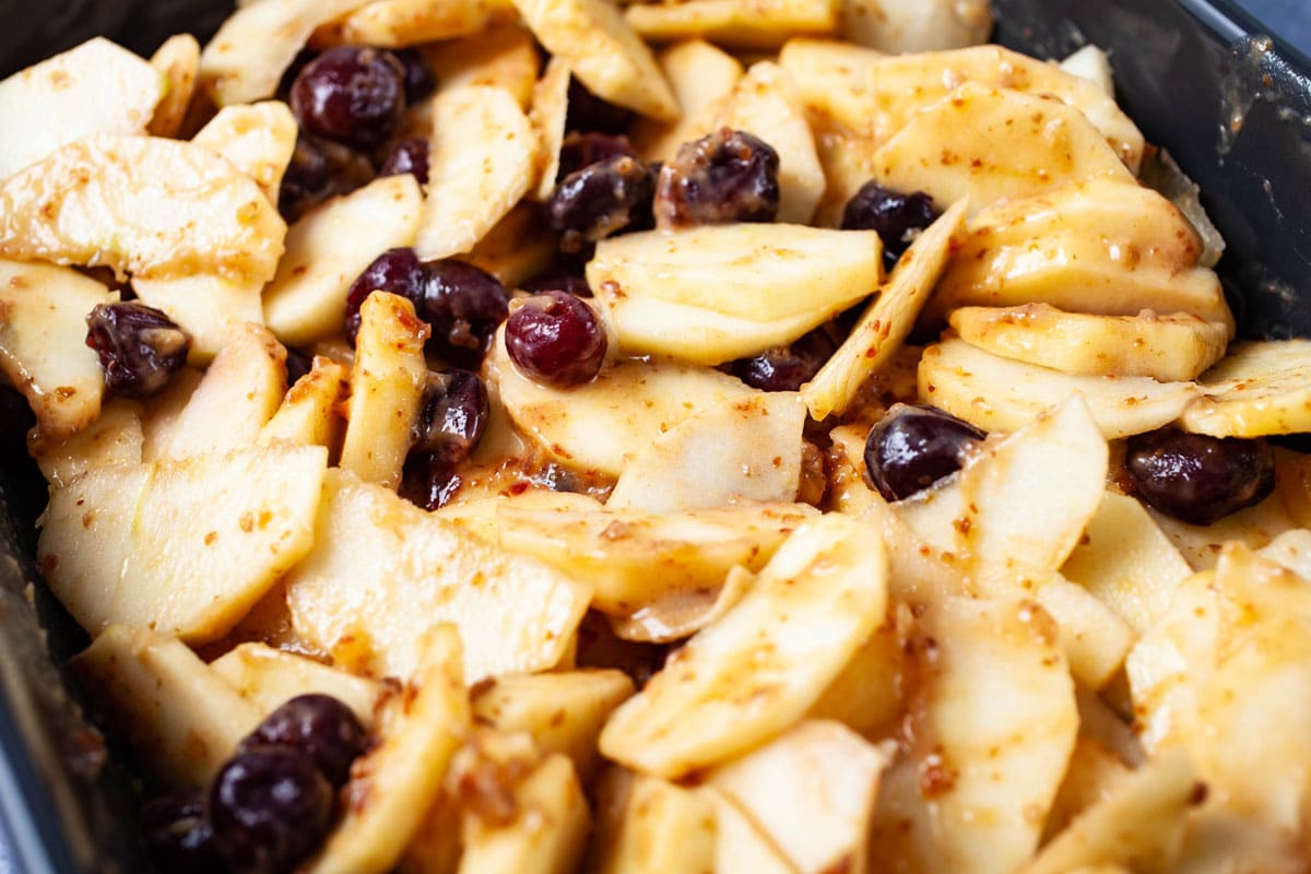 Sliced apples and cherries coated with a sweet date paste.