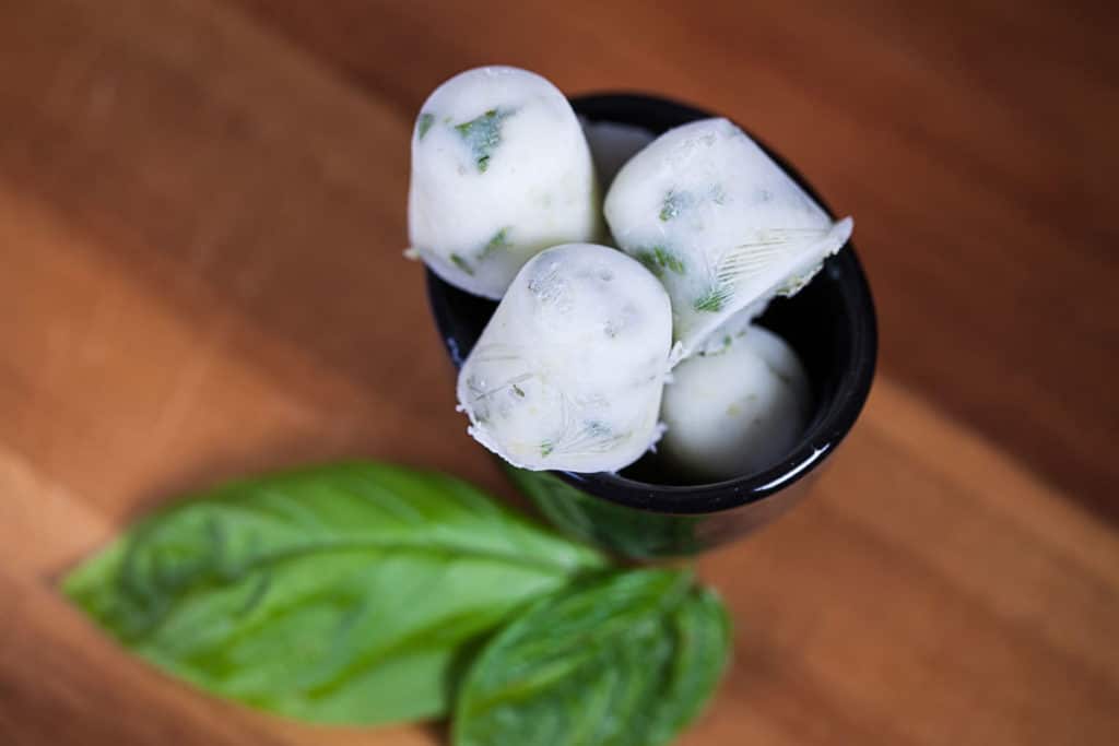 Herbal mini ice cubes in a small bowl.