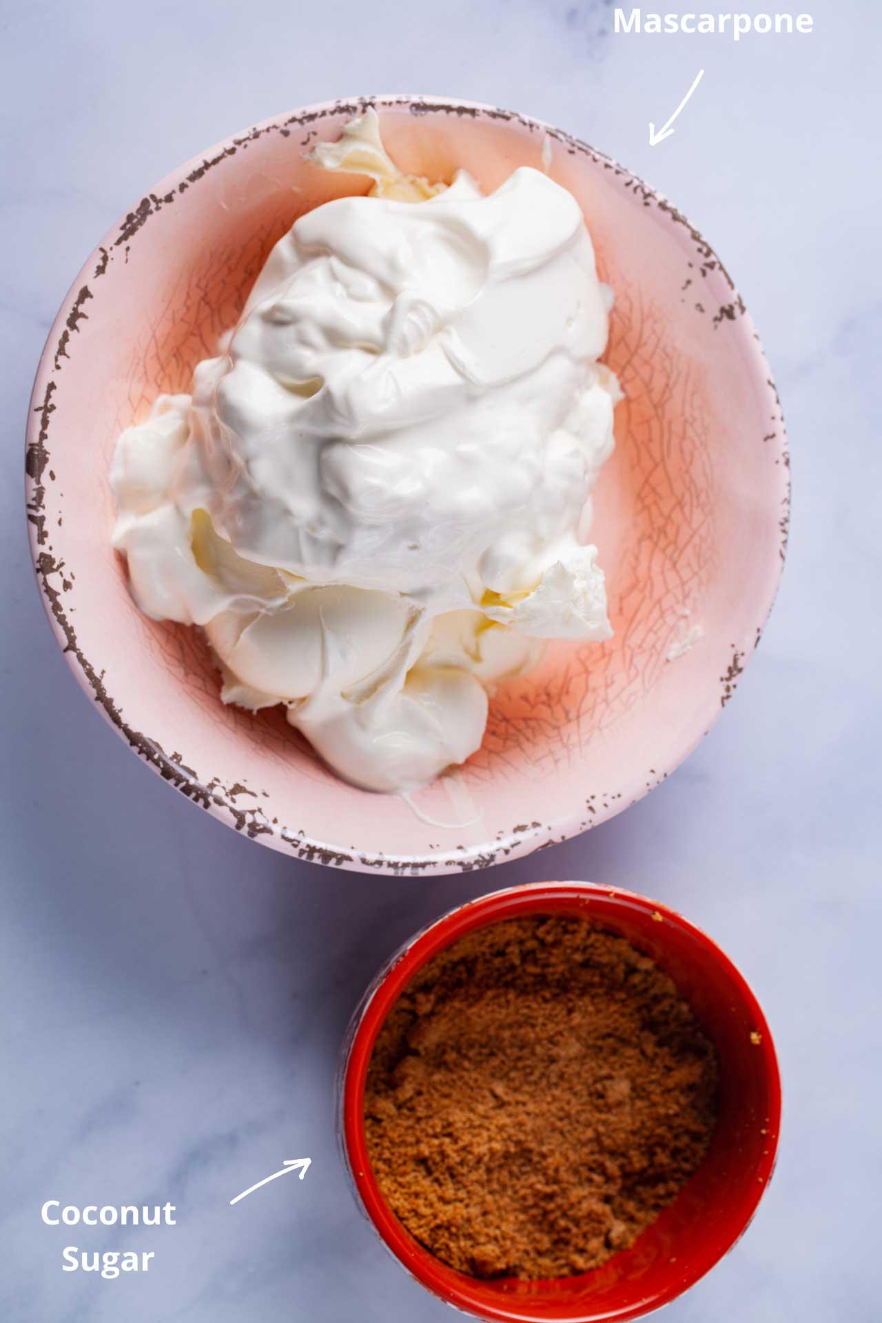 One bowl containing mascarpone cheese, and another with coconut sugar.