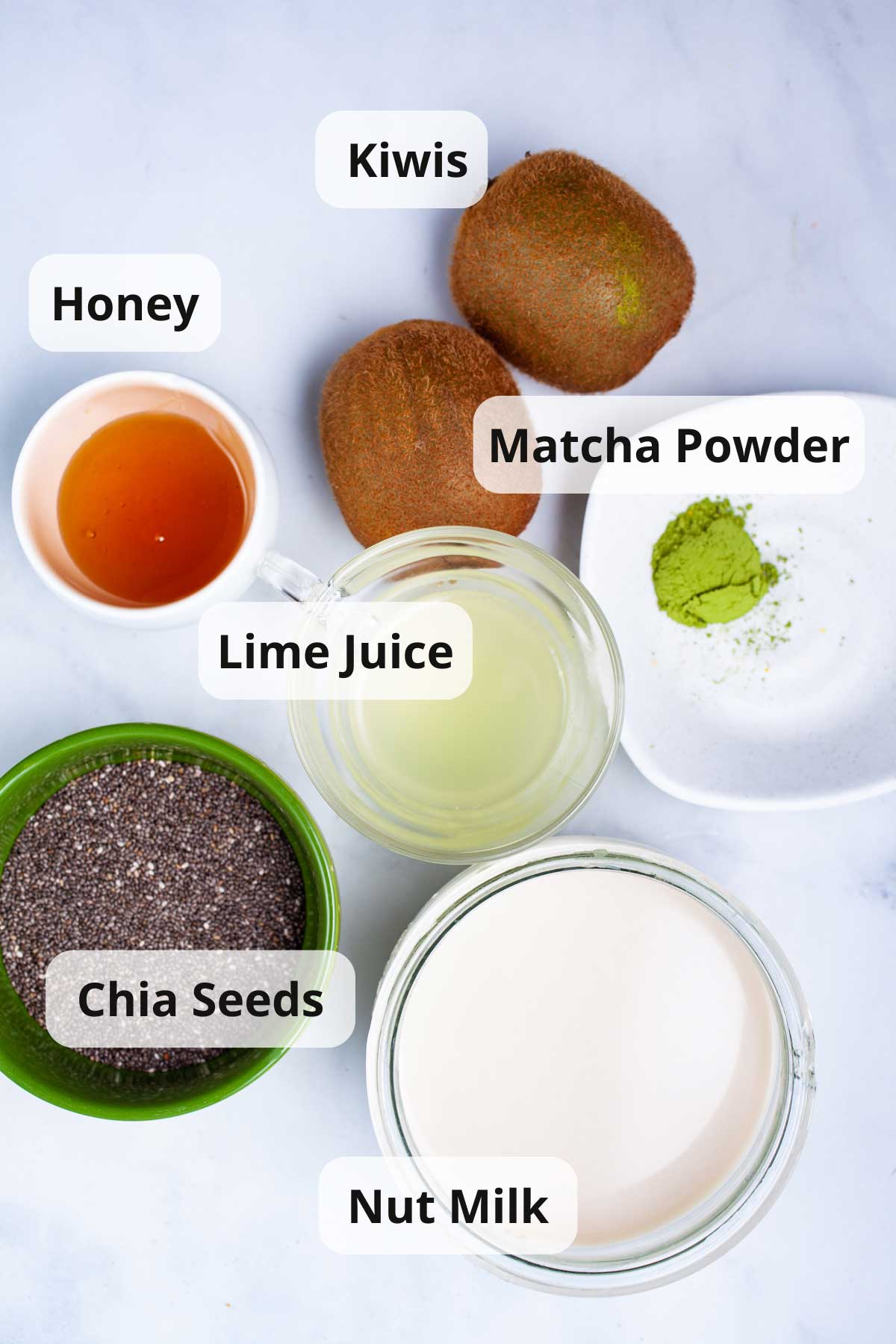 Ingredients laid out on a table to make kiwi chia pudding.