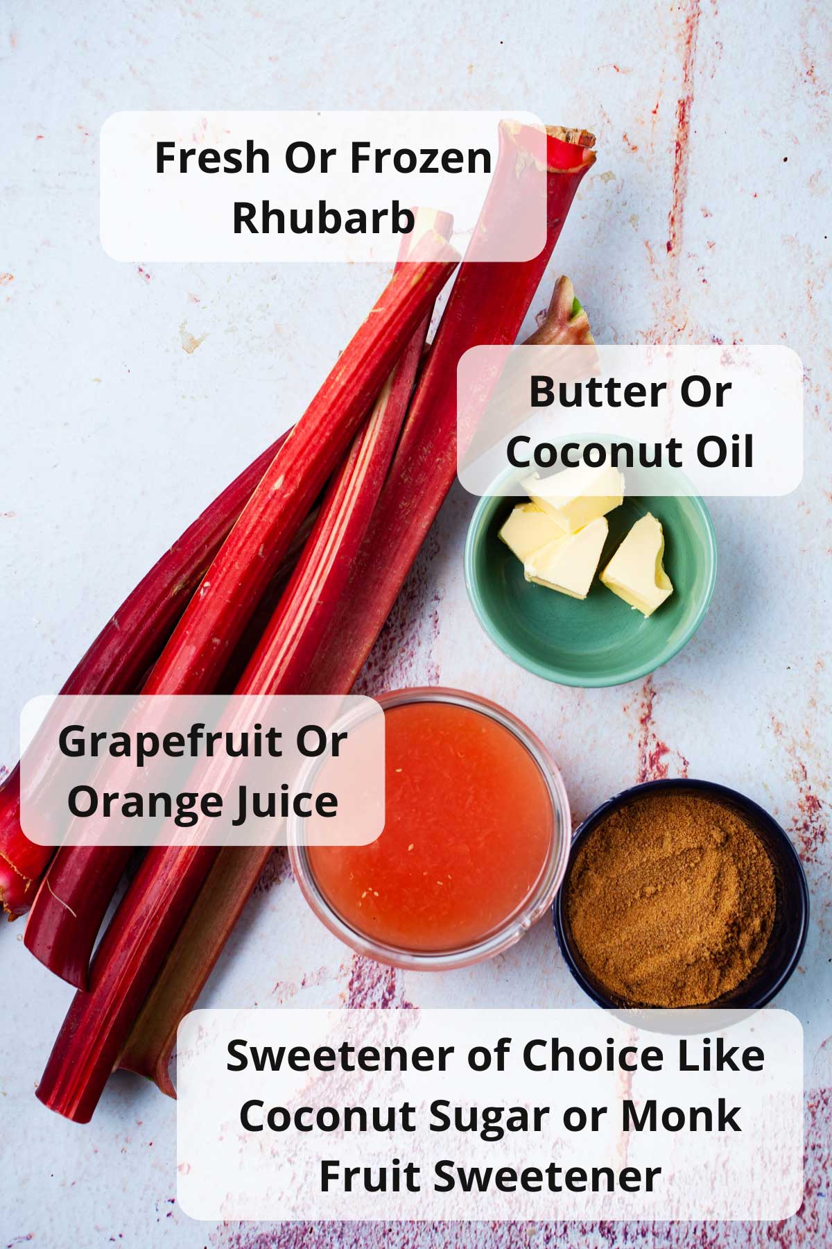 Fresh rhubarb, butter, grapefruit juice, and coconut sugar displayed on a table.