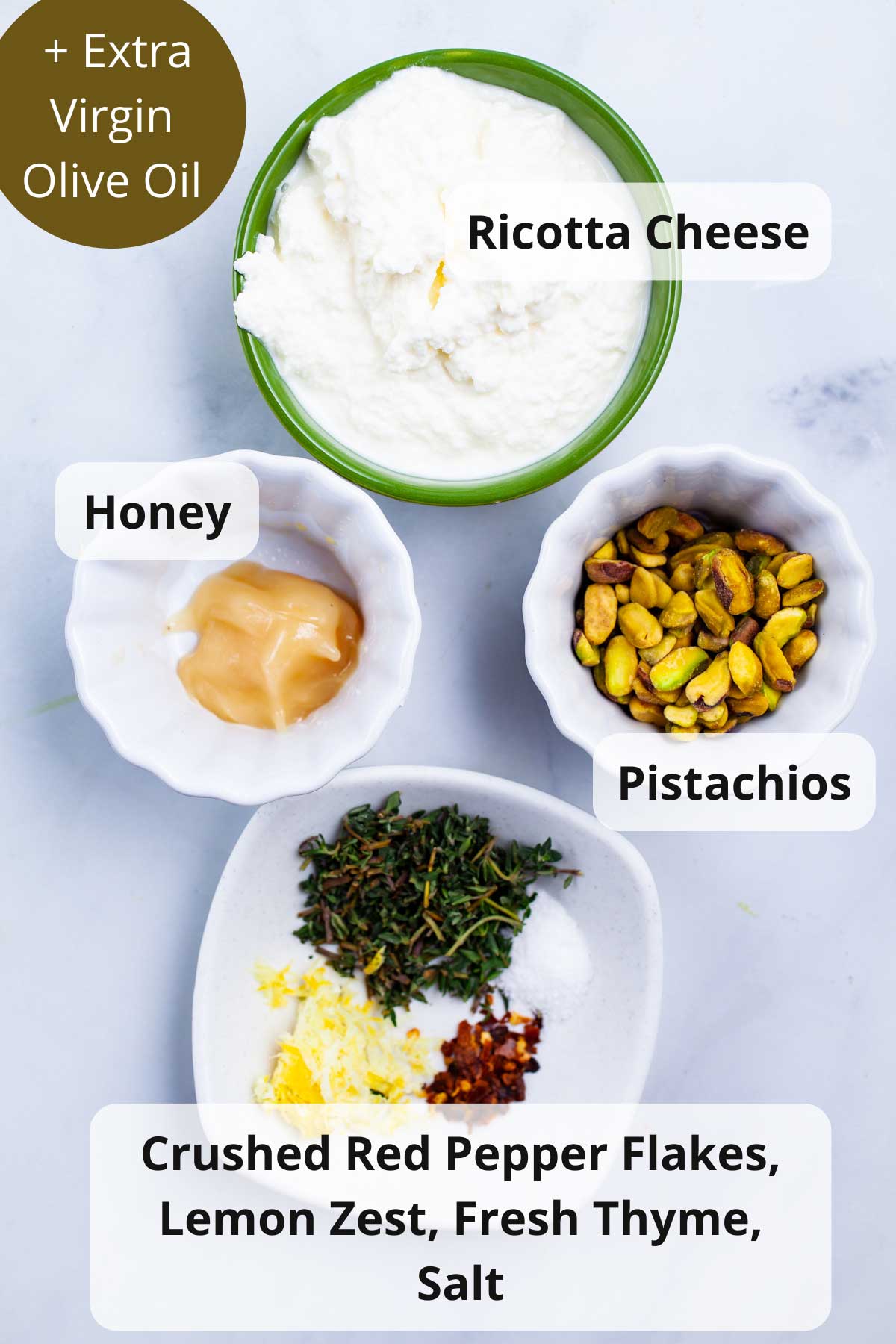 Ingredients on a table to make whipped ricotta and honey spread.