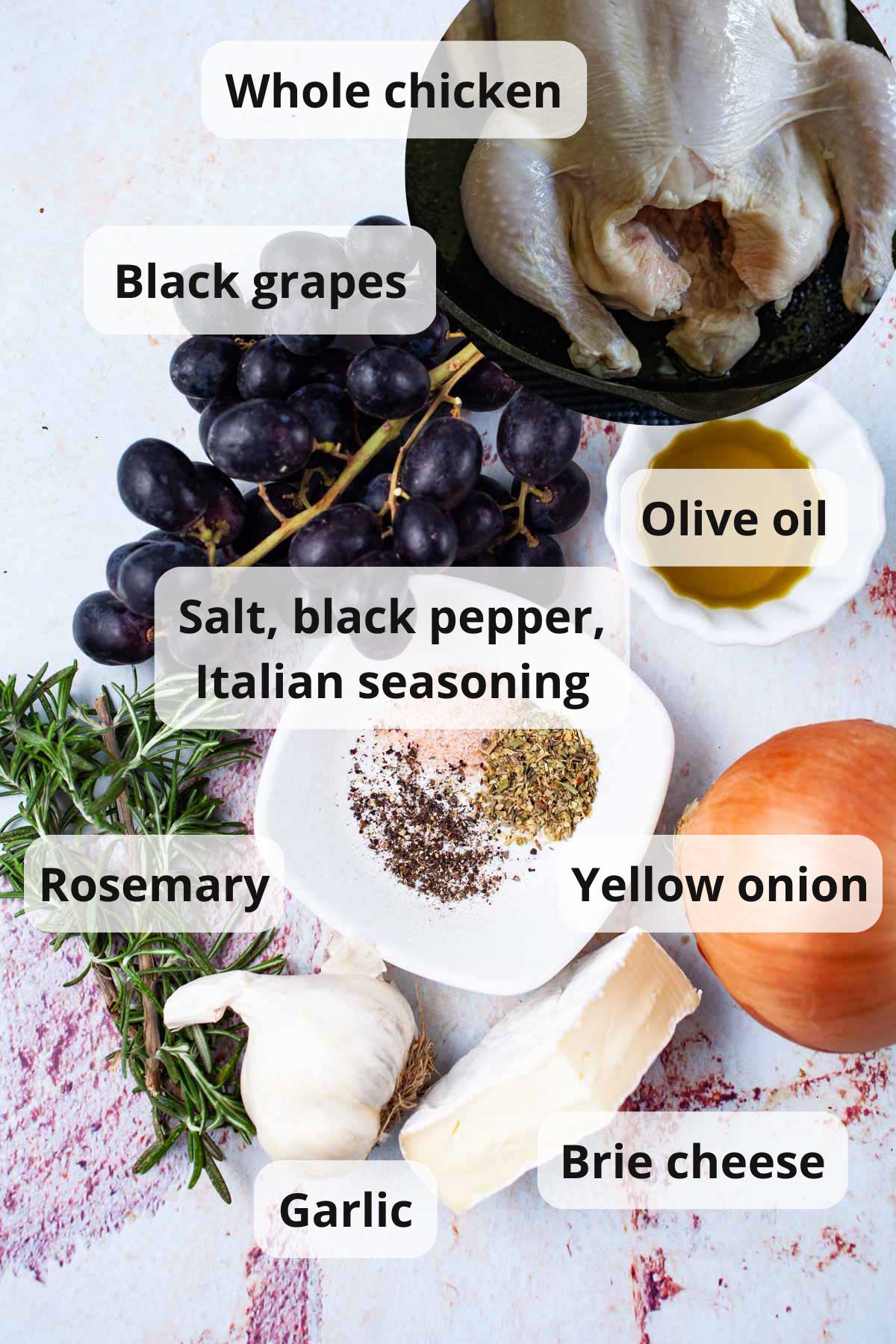 Ingredients displayed on a table to make an olive oil roast chicken with pan juices.