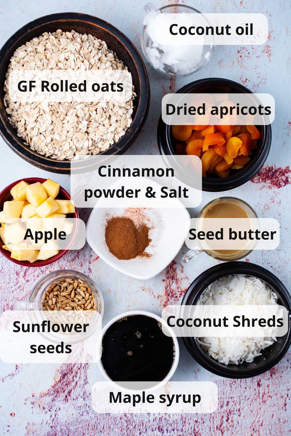 Ingredients to make a nut-free granola recipe at home displayed on a table.