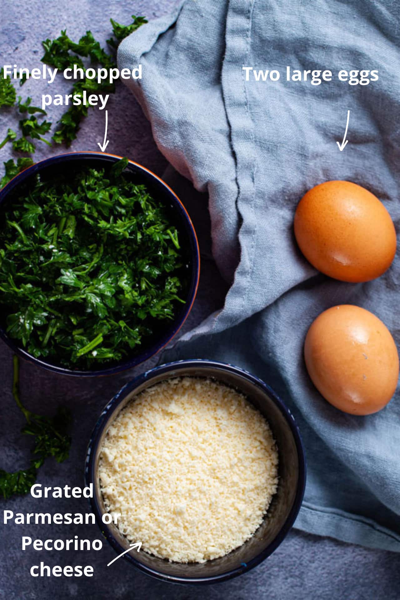 close-up of grated parmesan cheese coming down from the rotating