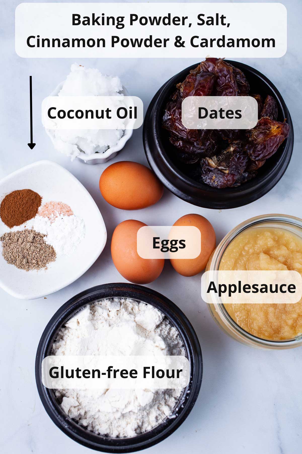 A set of ingredients on a table to make a date cake.
