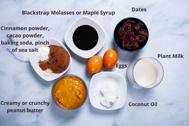 Ingredients to make flourless peanut butter cookies: blackstrap molasses or maple syrup, dates, plant milk, eggs, coconut oil, creamy or crunchy peanut butter, cinnamon powder, cacao powder, baking soda, pinch of sea salt.