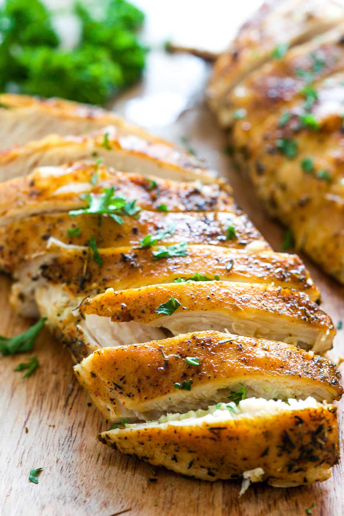 Cut tender cooked chicken breast.
