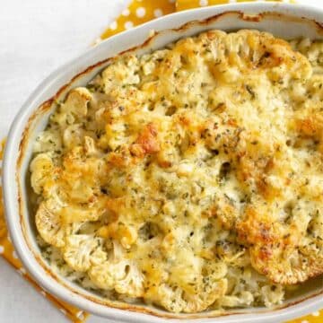 Roasted cheesy cauliflower in a casserole.