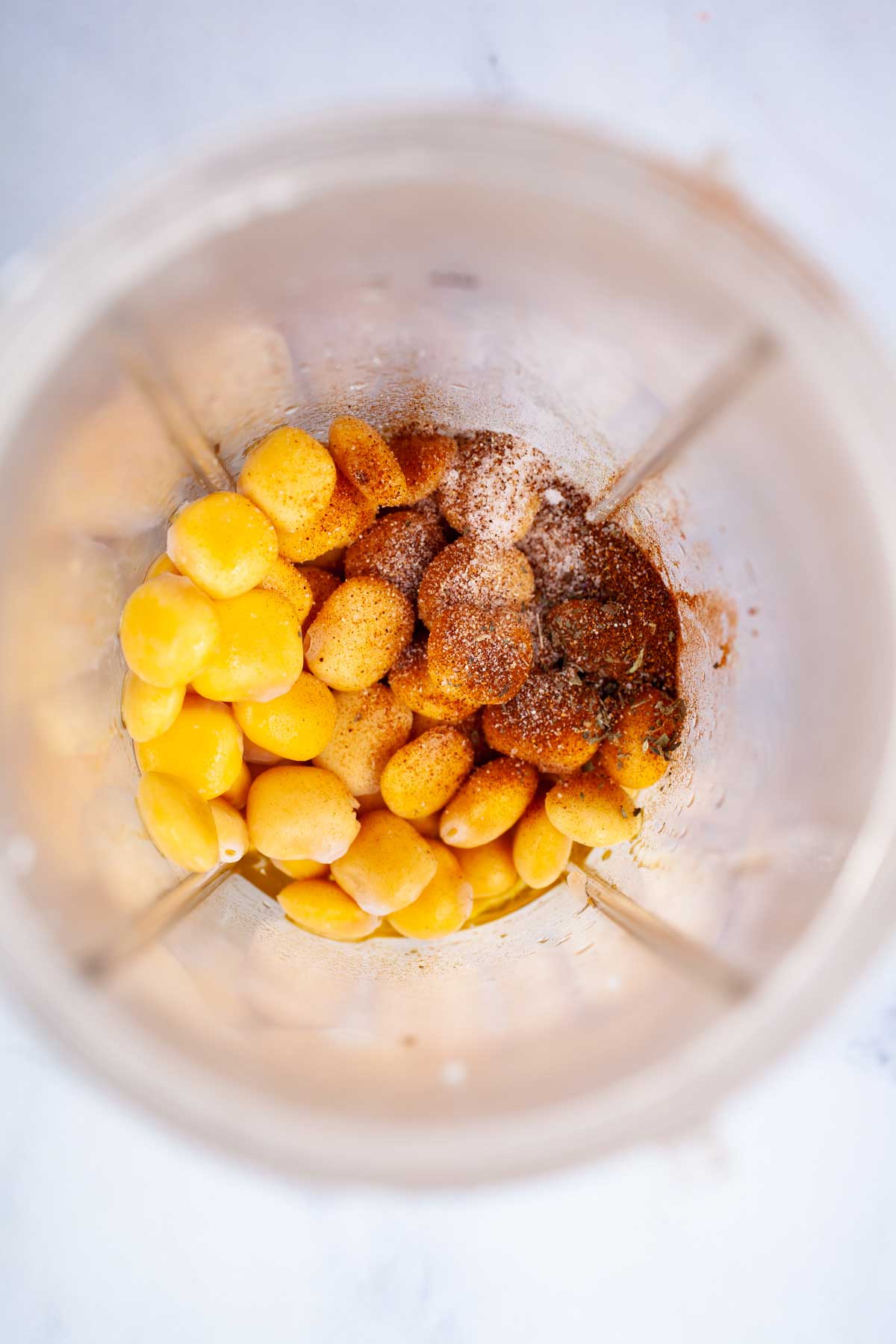 Lupini beans and seasoning in a blender.