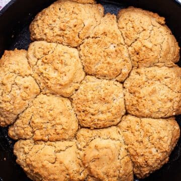 Rosemary Drop biscuits in a cast-iron skillet.