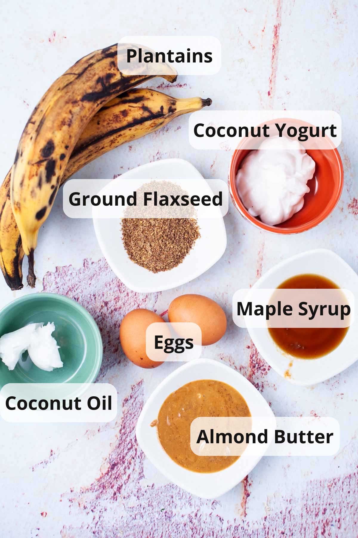 Ingredients placed on a table to make flourless plantain pancakes.