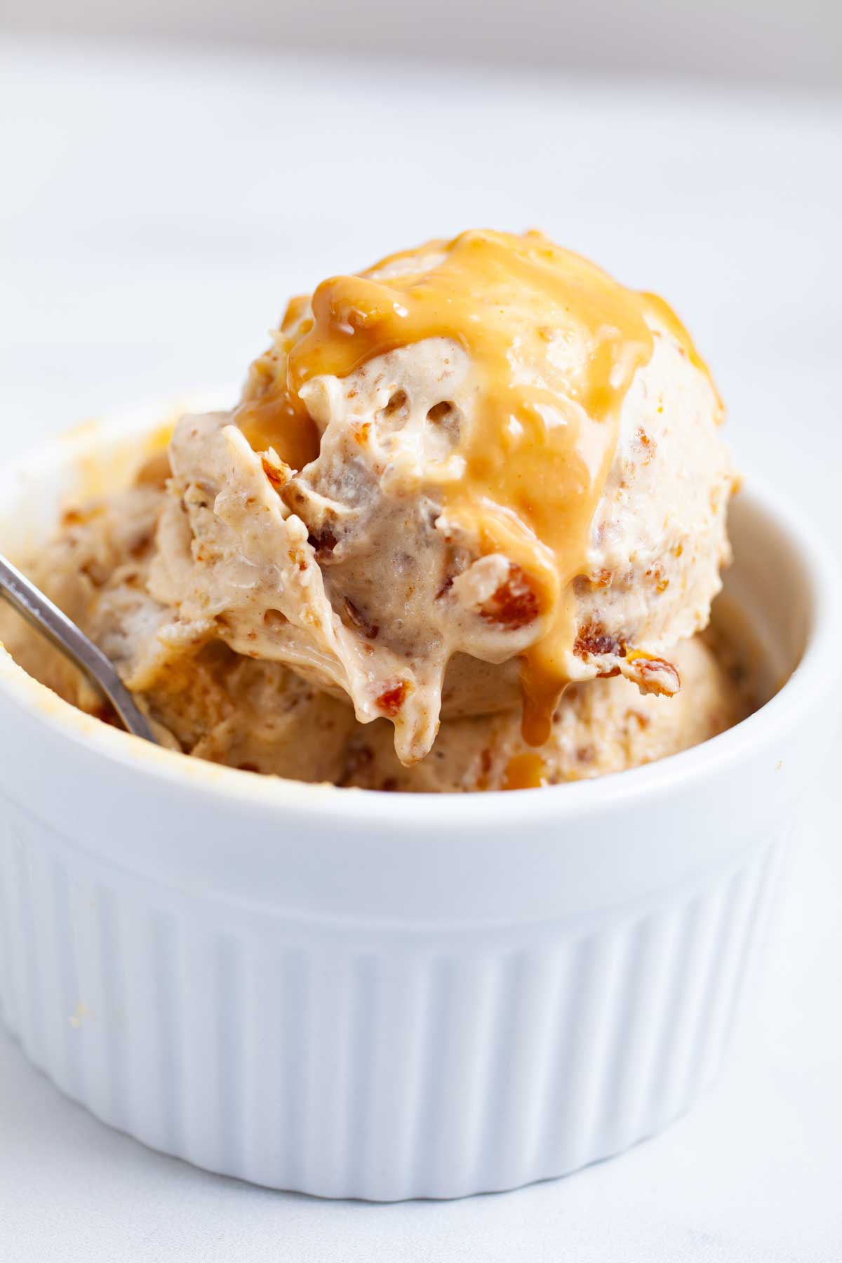 Salted date peanut butter nice cream served in a ramekin.