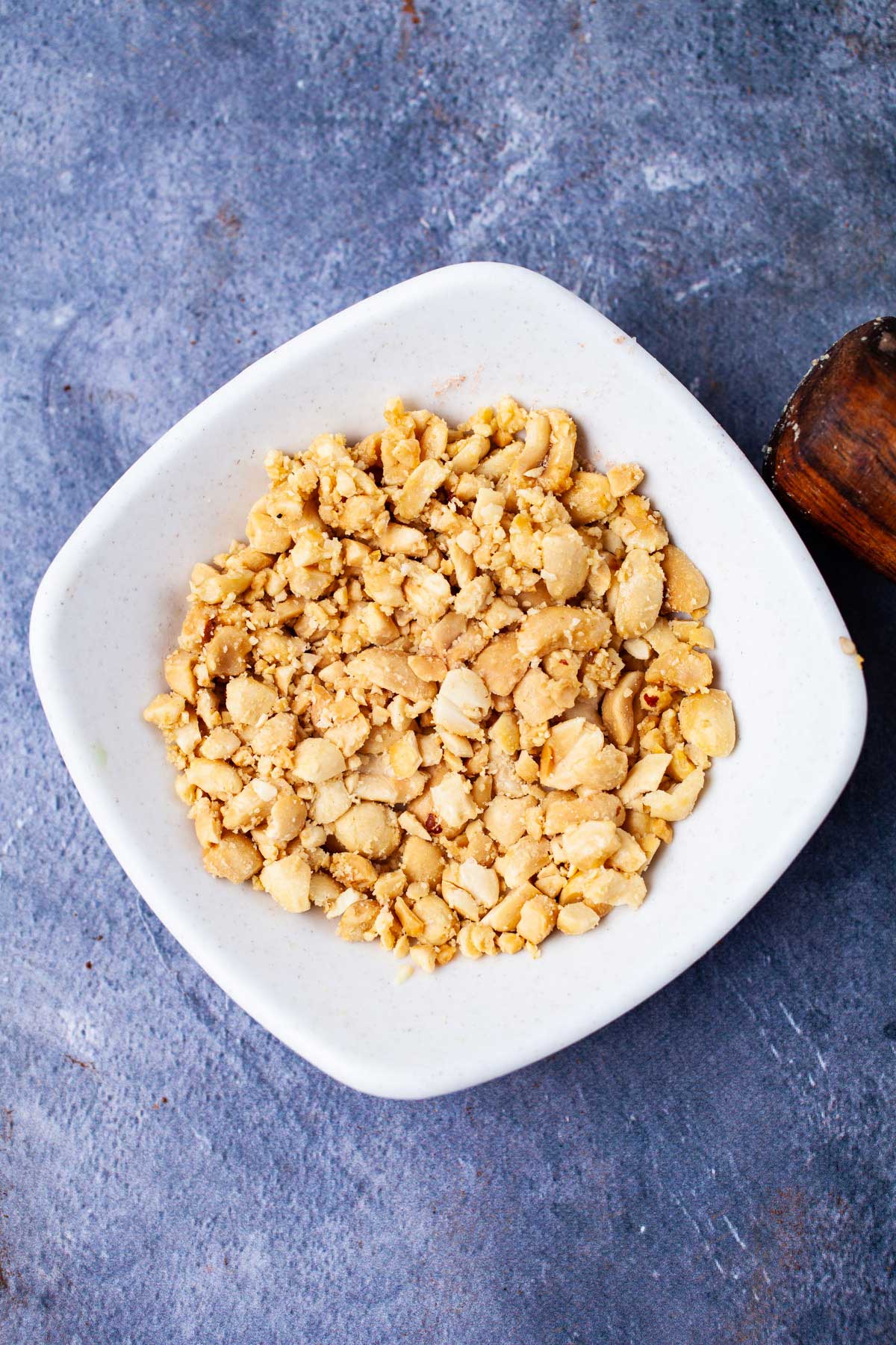 Chopped peanuts in a small bowl.