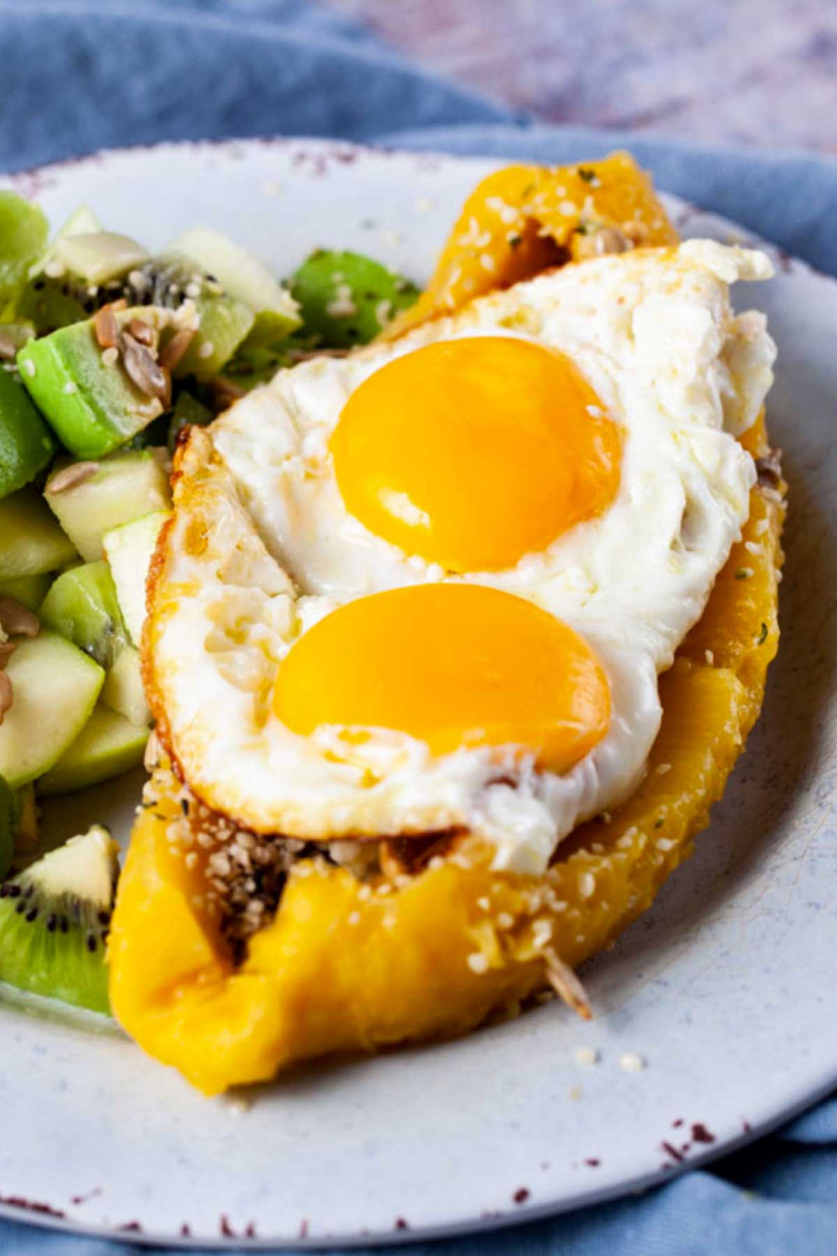 Microwaved softened sweet plantain topped with sunny side-up eggs.
