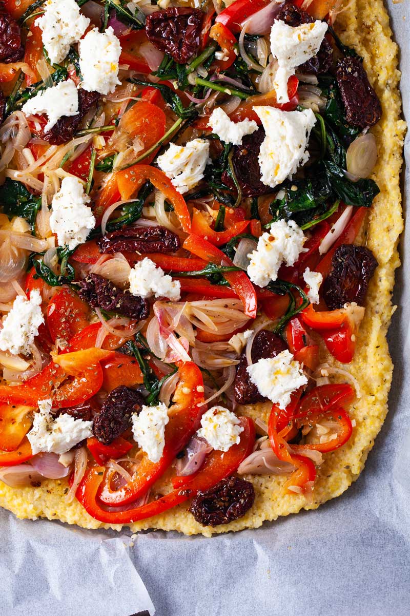 Savory gluten-free pizza with veggie toppings, and mozzarella.