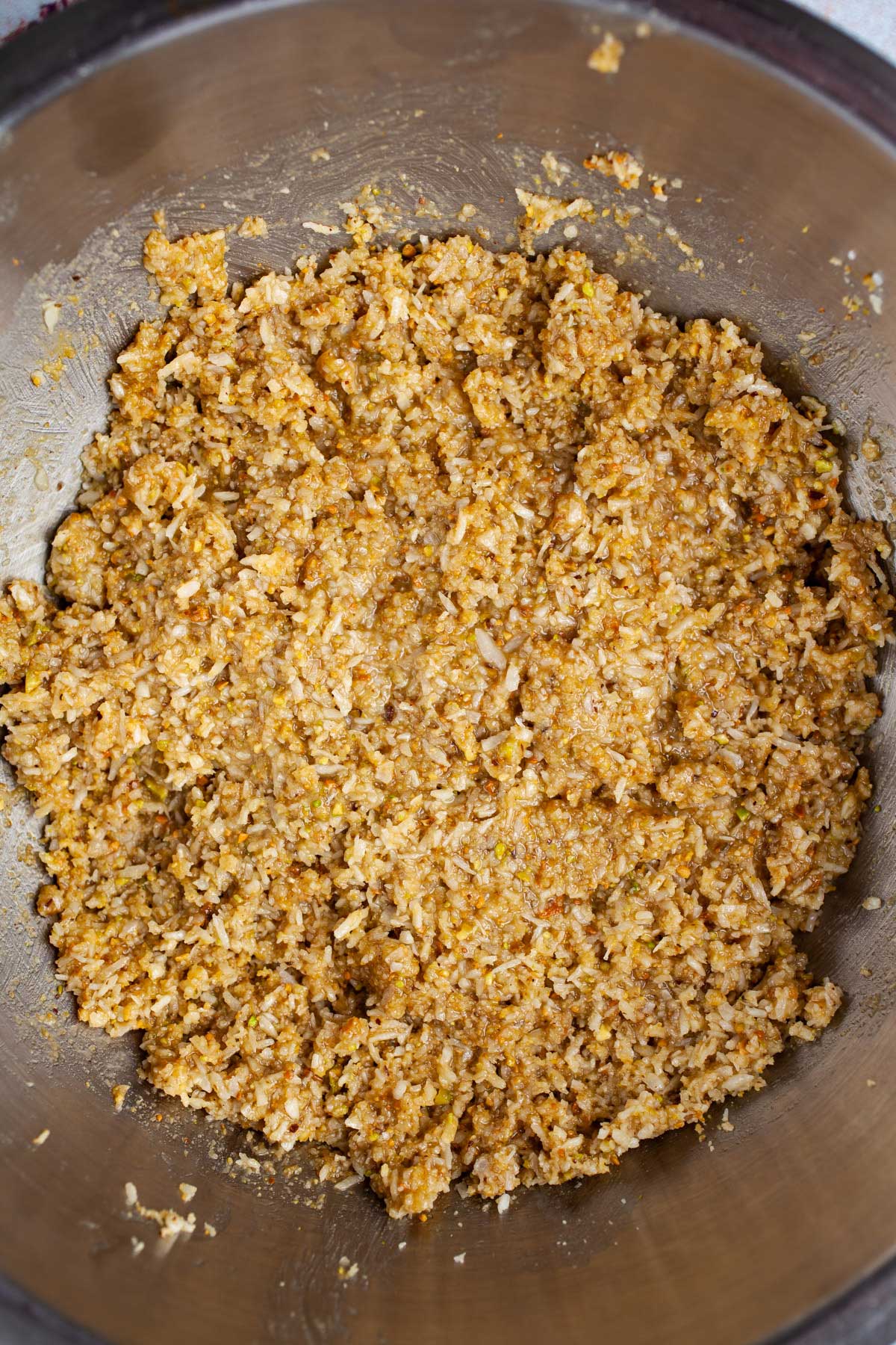 Sticky coconut flakes to make coconut balls.