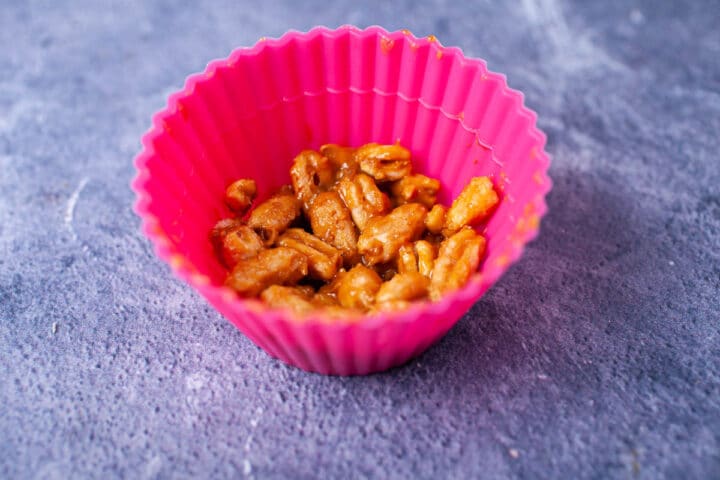 Sticky Kamut puffs in a cupcake holder.