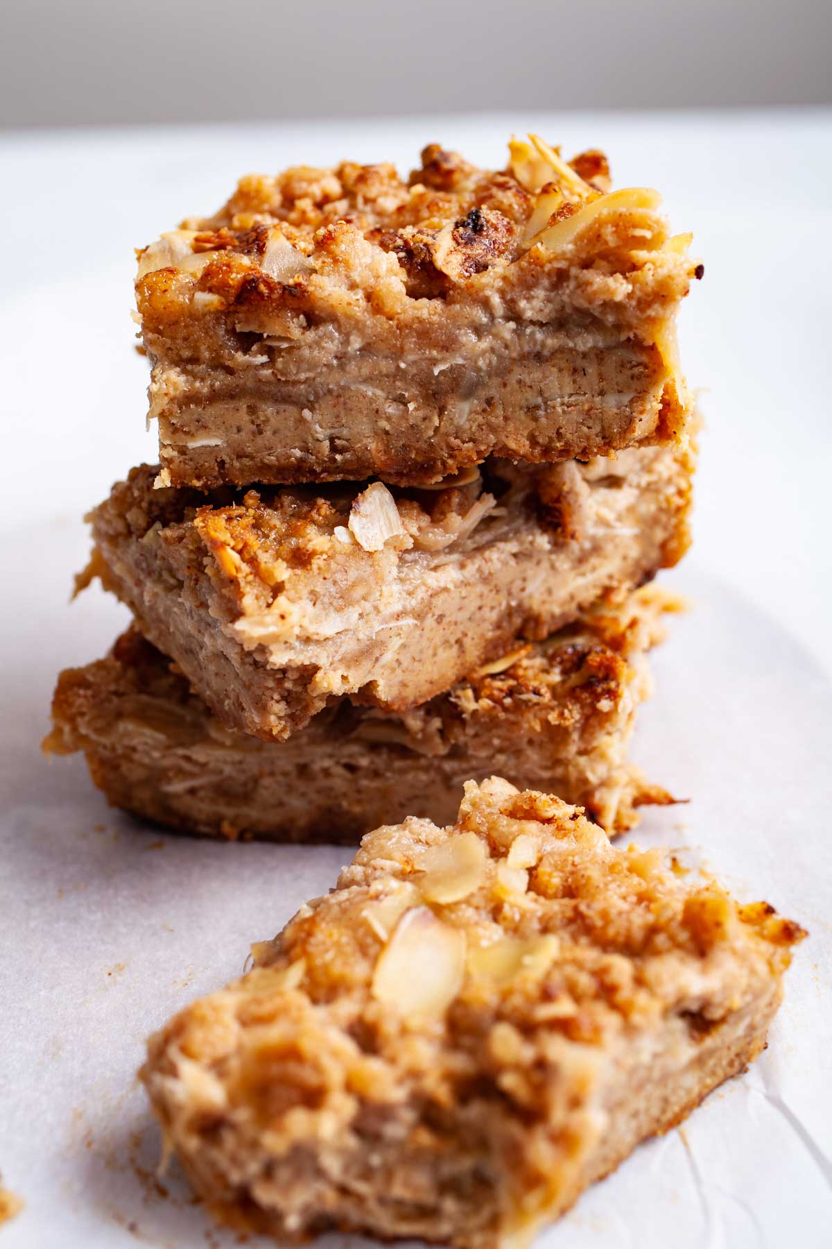 Almond flour rhubarb cookie bars stacked on top of each other.