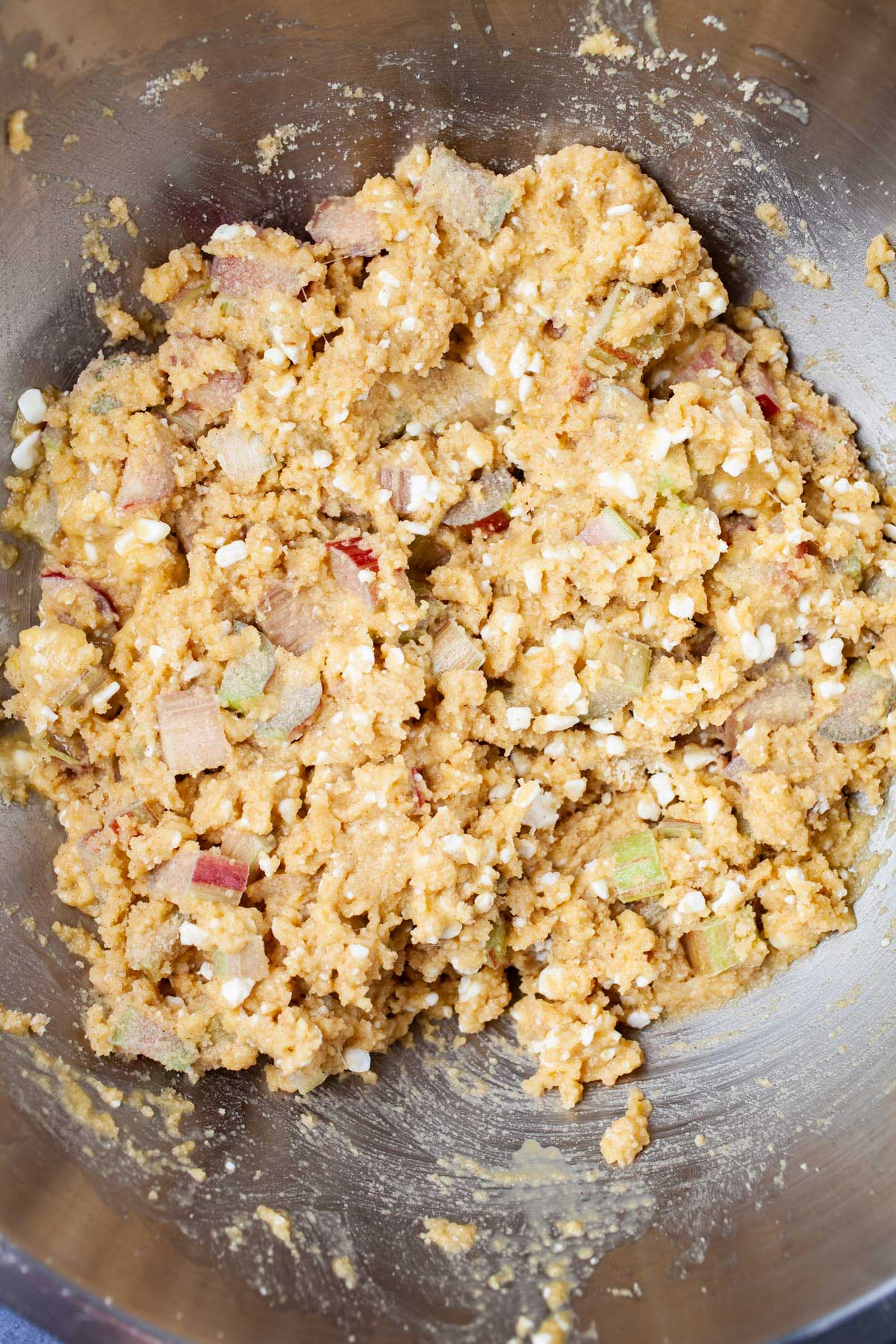 Batter in a large bowl to make rhubarb muffins.