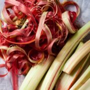 Peeled raw rhubarb on a table.