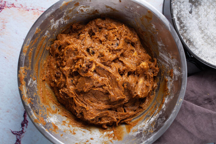 Fig cake batter in a stainless steel bowl.