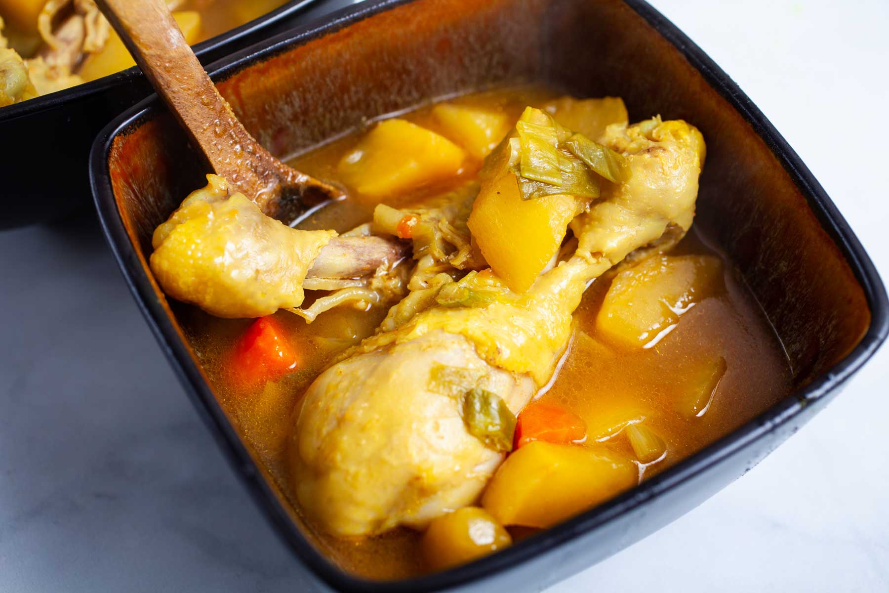 Swede soup with chicken legs served in a small soup bowl.