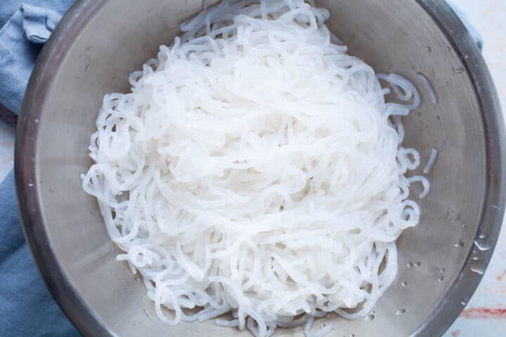 White Shirataki noodles in a stainless steel bowl.