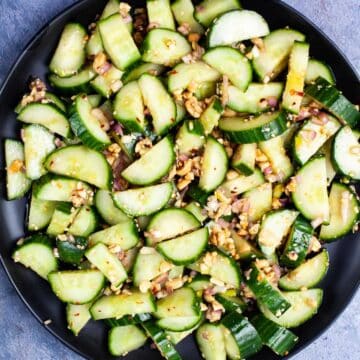 Chopped cucumbers and onions topped with a spicy dressing and chopped peanuts.