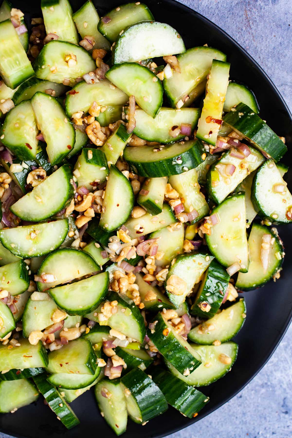 Chopped cucumbers and onions topped with a spicy dressing and chopped peanuts.