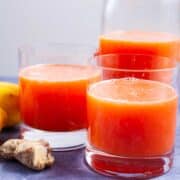 Grapefruit juice served in glasses.