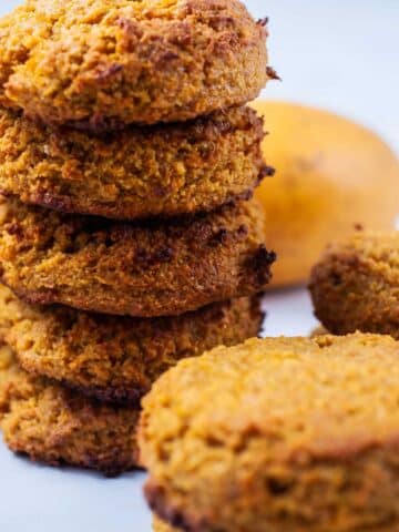 Mango cookies stacked on top of each other.