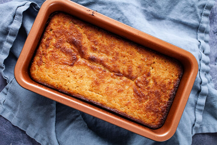 A beautifully browned yogurt cake in a rectangle cake pan.