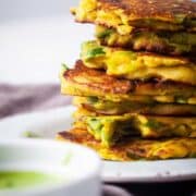 Gluten-Free leek fritters stacked on top of each other.