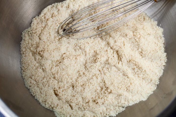 A whisk stirring into very fine almond flour.