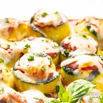 Rolled up zucchini slices baked and topped with a cheesy filling.