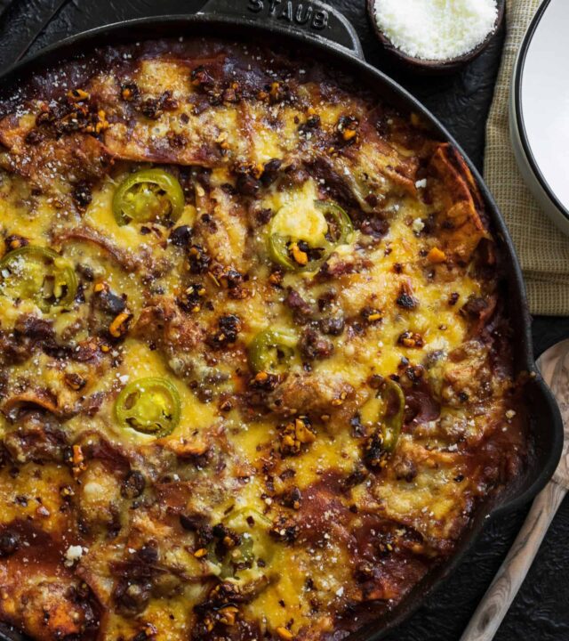 an overhead shot of burrito casserole in a cast iron skillet.
